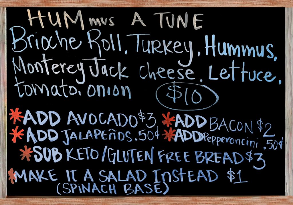 Happy Wednesday. Today the Special Sandwich is a House Made Brioche Roll with Turkey, Roasted Red Pepper Hummus, Monterey Jack Cheese, Tomato, Onion, and Lettuce.  $10 Add Avocado($3), Add Bacon($2), Extra Meat($3), Add Jalapeños or Pepperoncini Peppers($.50), Gluten Free/Keto Options: No Bread, Sub Spinach Salad(+$1), Sliced Keto & Gluten Free Bread(+$3)