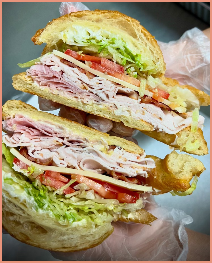 One of the Most Commonly Ordered Sandwiches on Our Menu is the Hot Croissant Club…. But have you tried it COLD? We Bake the Croissants in House Every Morning. The Club has Mayonnaise, Honey Dijon Mustard, Smoked Turkey, Black Forest Ham, Hickory Smoked Bacon, Swiss Cheese, Tomato, and Shredded Lettuce. Popular Additions are Avocado and/or Pepperoncini Peppers. Try Your Club Cold Next Time!